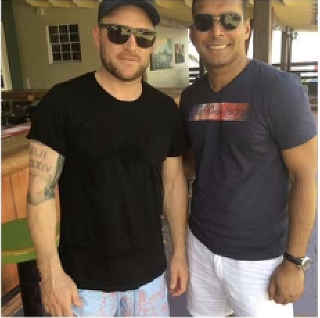 Kevin Rego with cricketer David Warner